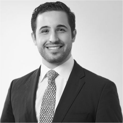 Headshot of Corey Omer, greyscale